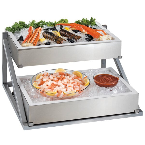 A Cal-Mil metal 2-tier ice housing display with seafood on ice.