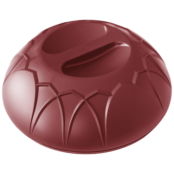 A red plastic Dinex Fenwick meal delivery dome with a hole on top.