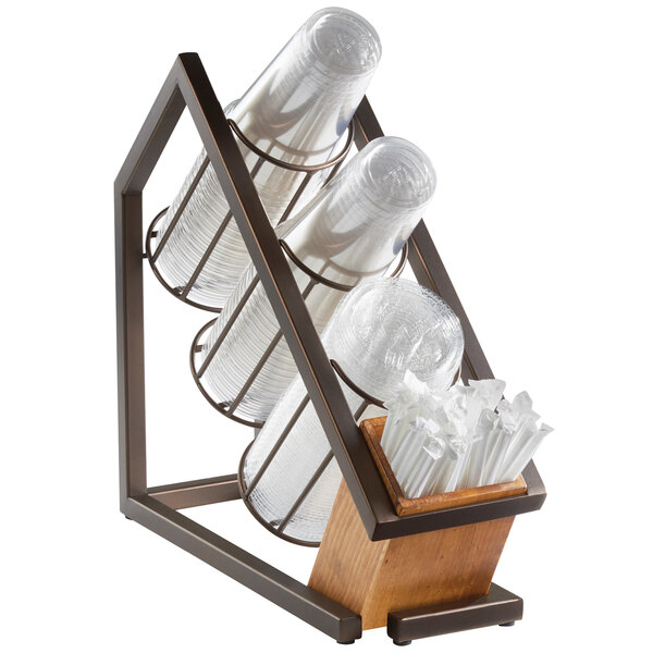 A bronze metal Cal-Mil countertop organizer with plastic cups and straws in three sections.