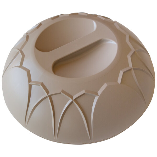 A beige Dinex insulated meal delivery dome with a circular design on it.