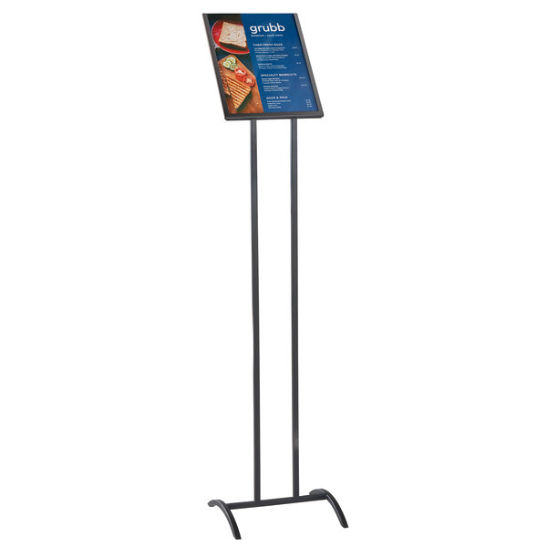 A black metal Cal-Mil sign holder stand with a sign on it.