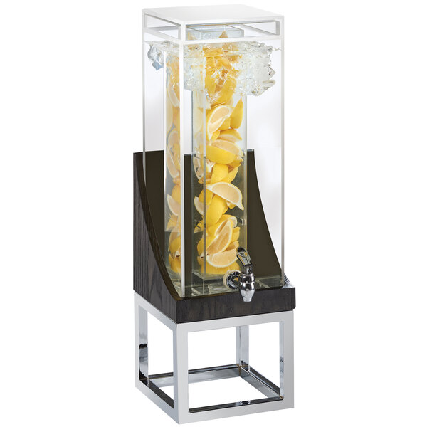 A Cal-Mil Cinderwood beverage dispenser with lemons inside.