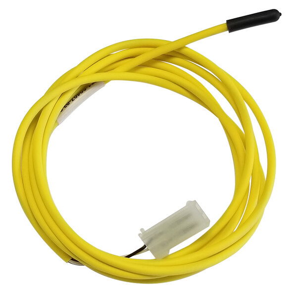 A yellow wire with a white connector on a Traulsen discharge sensor.