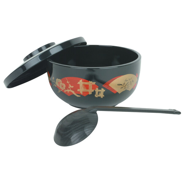 A black Thunder Group plastic noodle bowl with a lid and ladle on a counter.