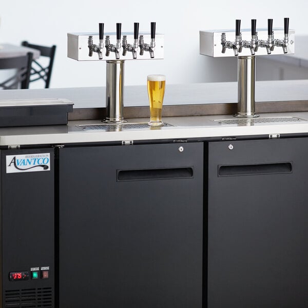An Avantco black rectangular beer dispenser with four beer taps.