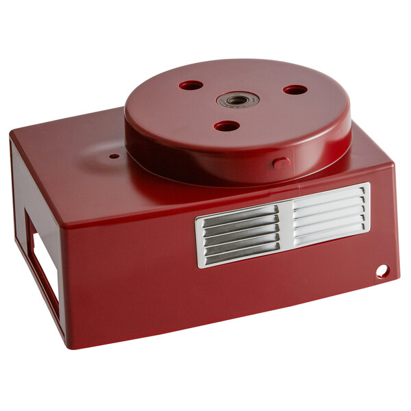 A red metal circular object with two metal vents.