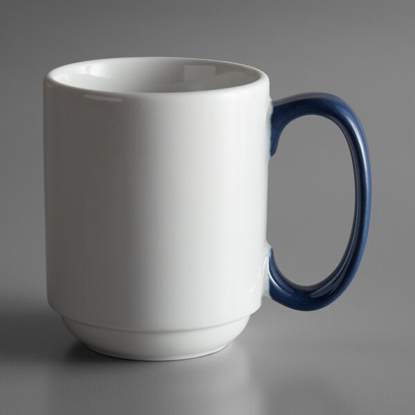 A white porcelain mug with blue stripes and a blue handle.