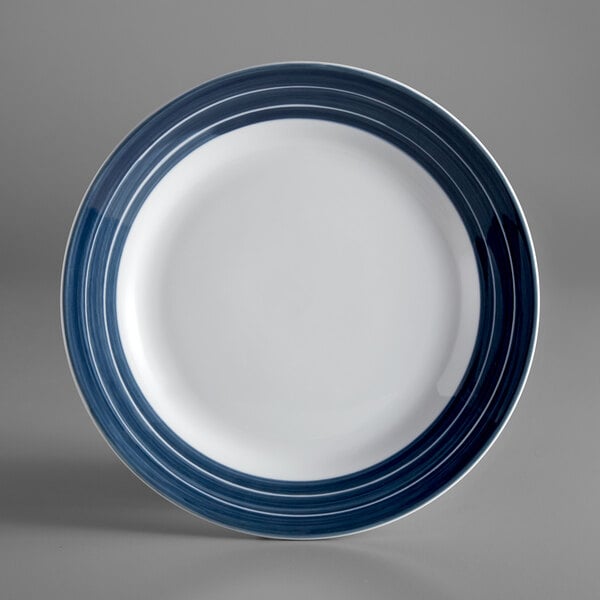 A white Libbey porcelain plate with blue stripes.