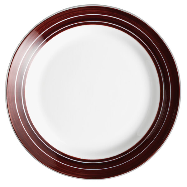 A close-up of a white Libbey porcelain plate with apple butter stripes.