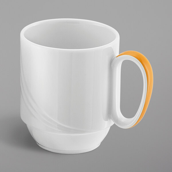 A close-up of a white Schonwald Donna Senior mug with an orange handle.