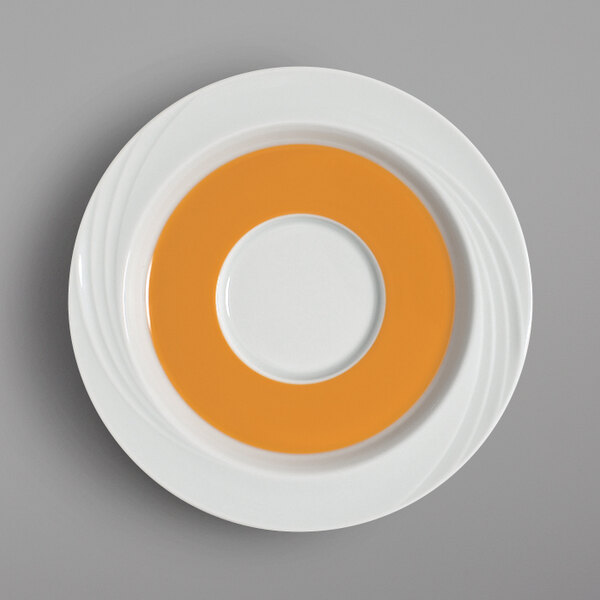 A white Schonwald saucer with an orange rim.