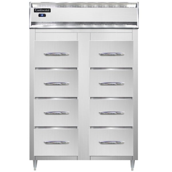 A white cabinet with silver handles and eight stainless steel drawers.