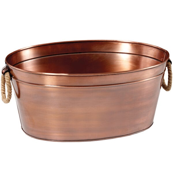 A copper-plated oval beverage tub with rope handles.