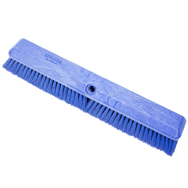 A blue Carlisle push broom head with bristles.