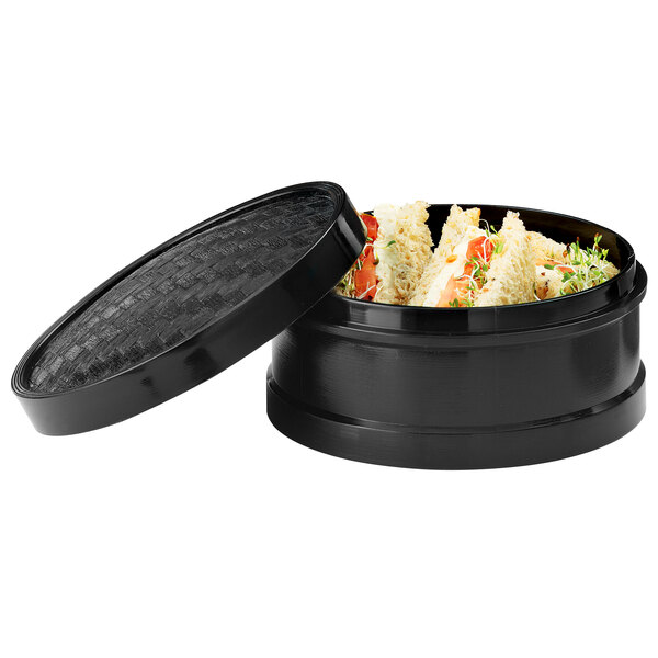 A black container with food inside.