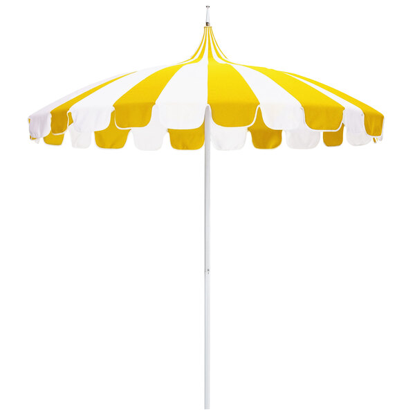 A California Umbrella with a yellow and white striped Sunbrella canopy.