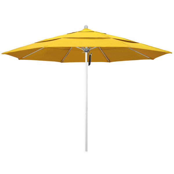 A close-up of a yellow California Umbrella with a silver pole and lemon yellow fabric.
