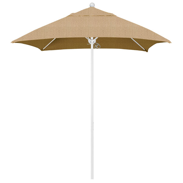 A tan umbrella with a white pole.
