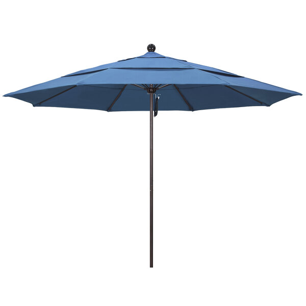A blue umbrella with a bronze metal pole.