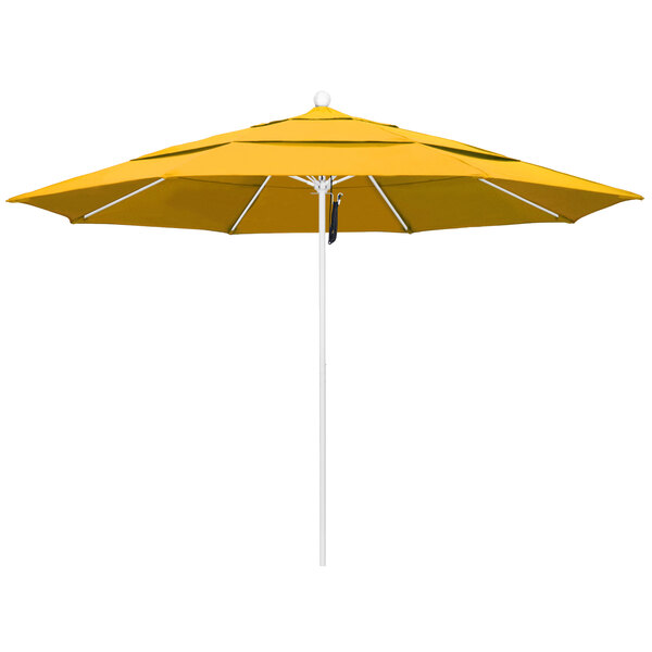 A close-up of a yellow California Umbrella on a white pole.