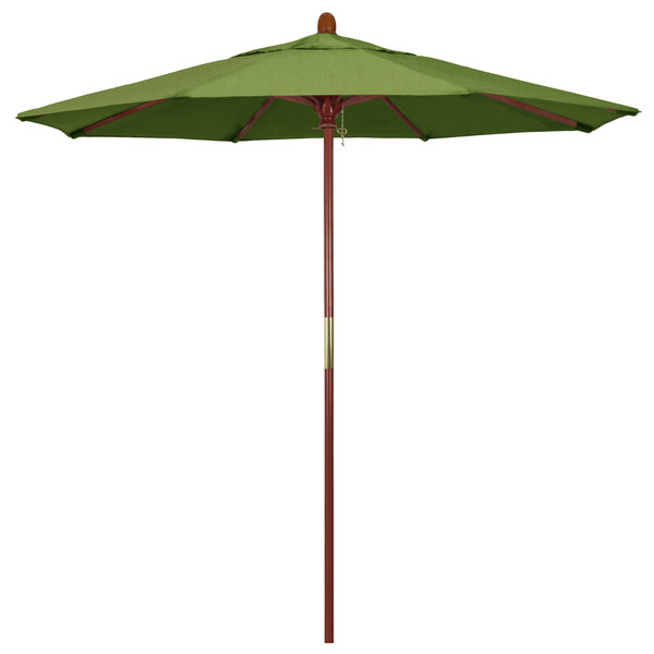 A green California Umbrella with a wooden pole.