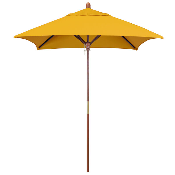A California Umbrella yellow Sunbrella canopy with a wooden pole.