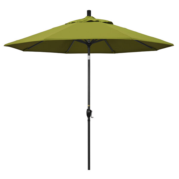 A green California Umbrella on a stone black pole.