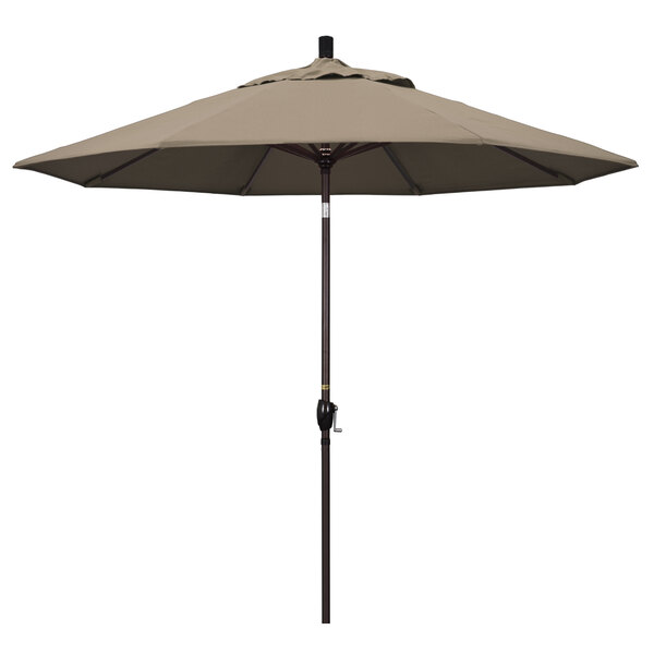 A taupe California Umbrella on a bronze pole.
