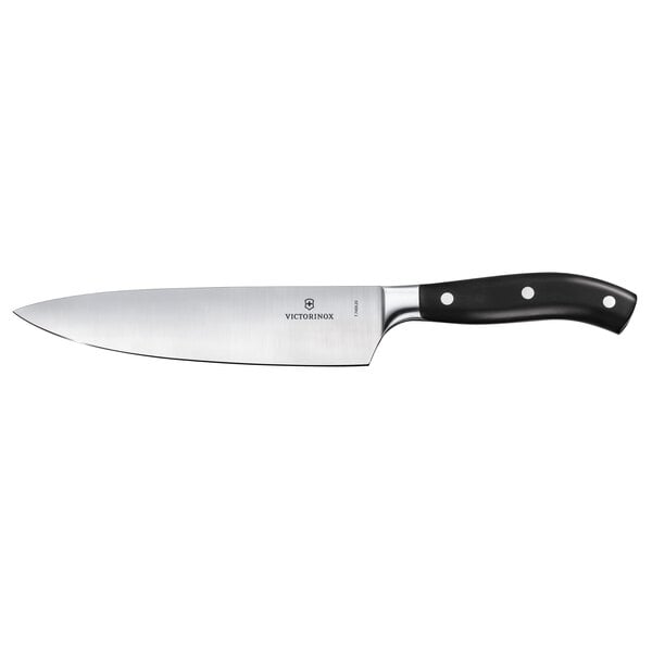 A Victorinox Grand Maitre chef knife with a black POM handle.