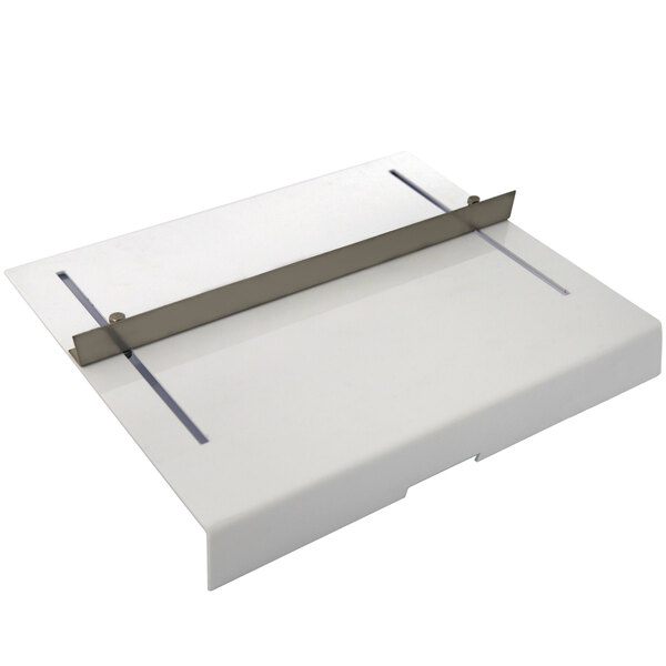 A white plastic rectangular tray with a metal strip.