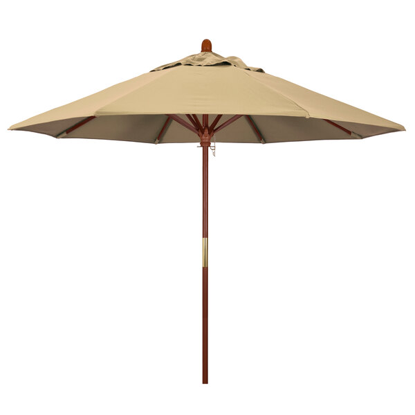 A tan California Umbrella with a wooden pole.