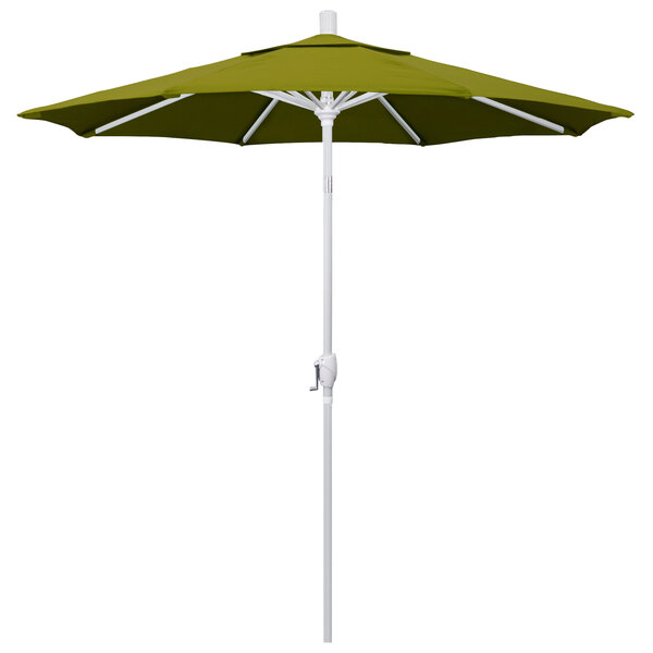 A green California Umbrella on a white pole.