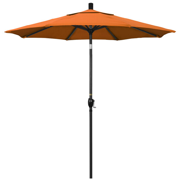 An orange umbrella with a stone black pole.