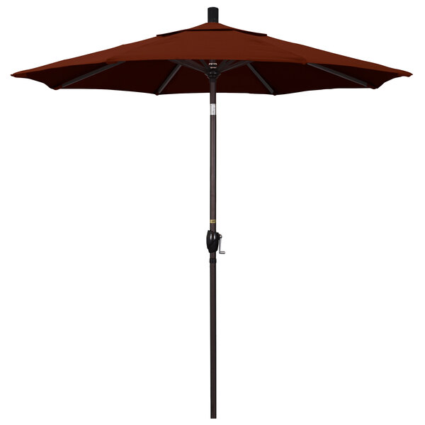 A brown California Umbrella with a bronze pole.
