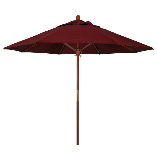 A red California Umbrella with a wooden pole.