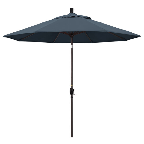 A California Umbrella Pacific Trail umbrella with a blue fabric and bronze pole.