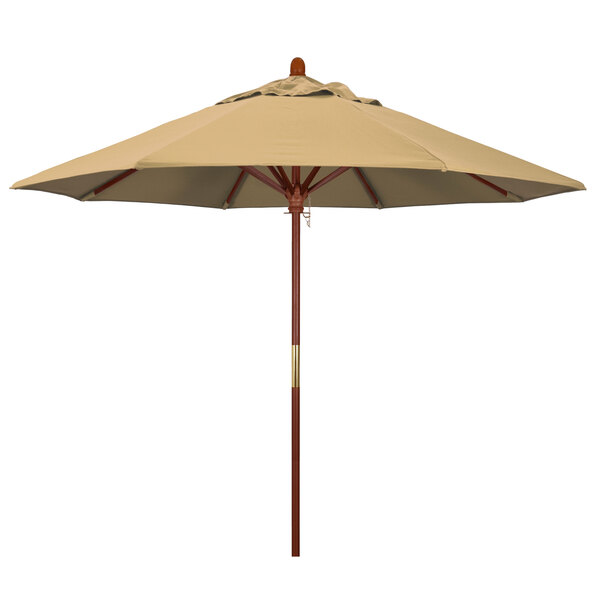 A tan California Umbrella with a wooden pole.
