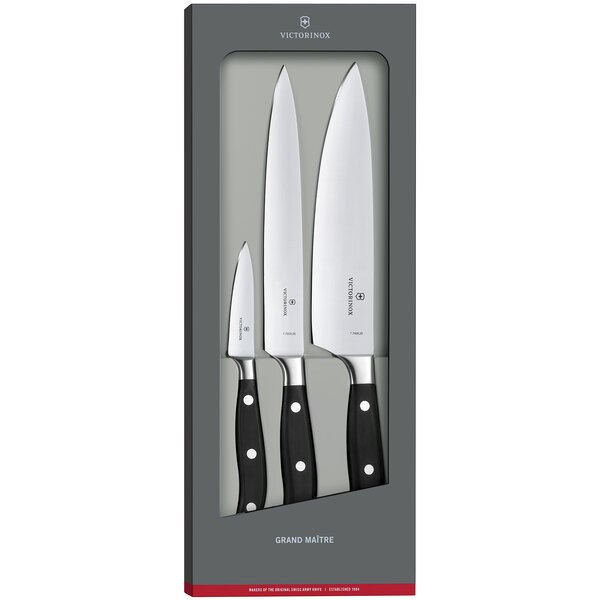 A Victorinox Grand Maitre 3-piece chef knife set in a box with white rectangular packaging.