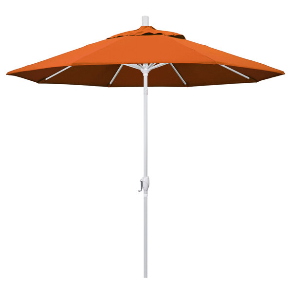 An orange umbrella with a white pole.