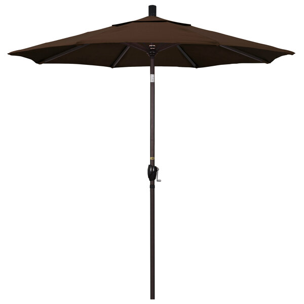A brown California Umbrella on a bronze pole.