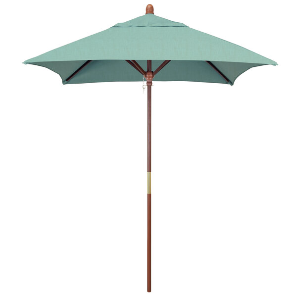 A close-up of a California Umbrella with a blue Sunbrella canopy and a wooden pole.