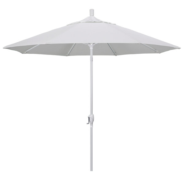 A natural fabric California Umbrella with a white pole.