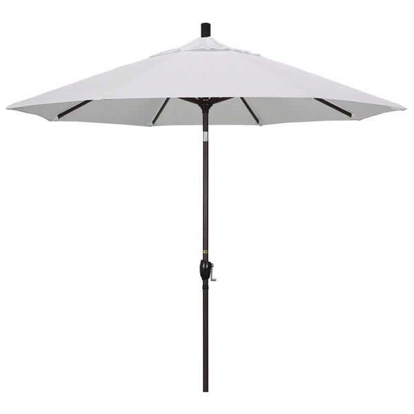 A natural fabric California Umbrella with a bronze pole.