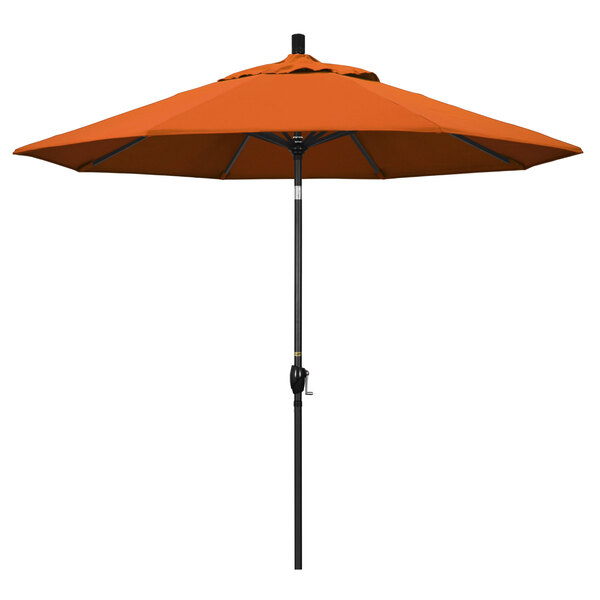 A Tuscan fabric California Umbrella with a stone black pole.