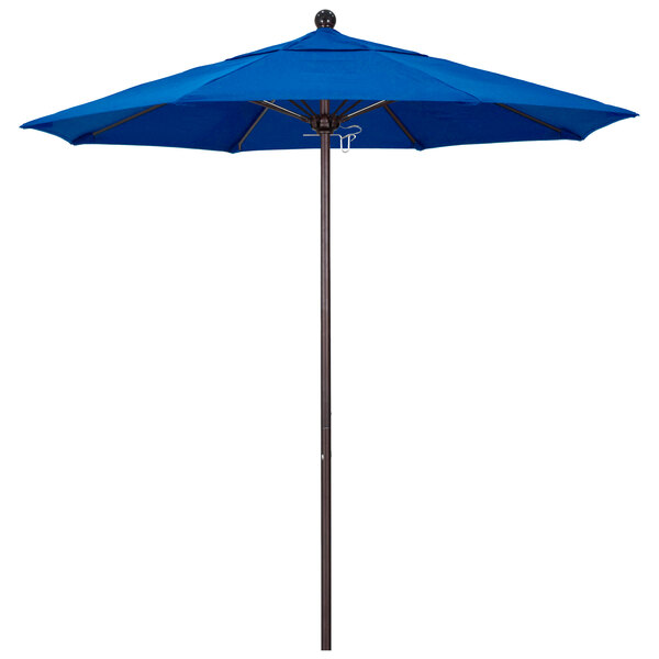 A California Umbrella Pacific Blue Sunbrella canopy on a bronze pole.