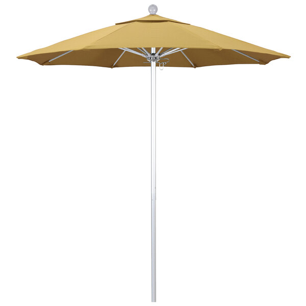 A yellow California Umbrella with a Sunbrella Wheat canopy on a white pole.