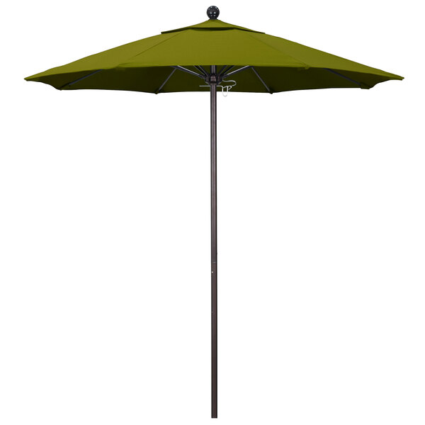 A Pacifica Ginkgo green California Umbrella on a bronze pole.