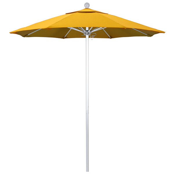 A close-up of a yellow California Umbrella with Sunflower Yellow Sunbrella fabric on a white pole.
