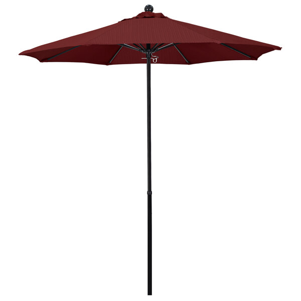A red California Umbrella with a black pole.