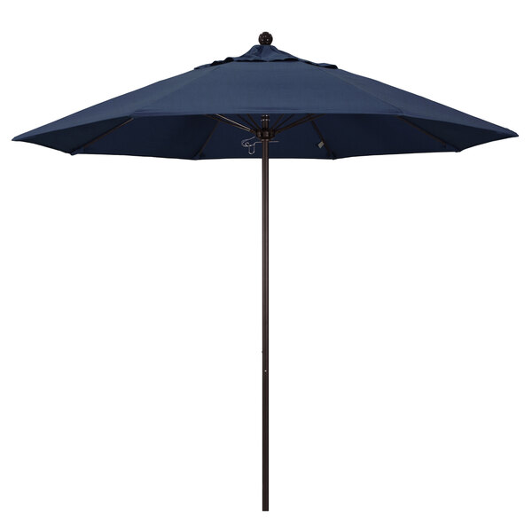 A blue California Umbrella with a bronze pole and Sunbrella Spectrum Indigo fabric.